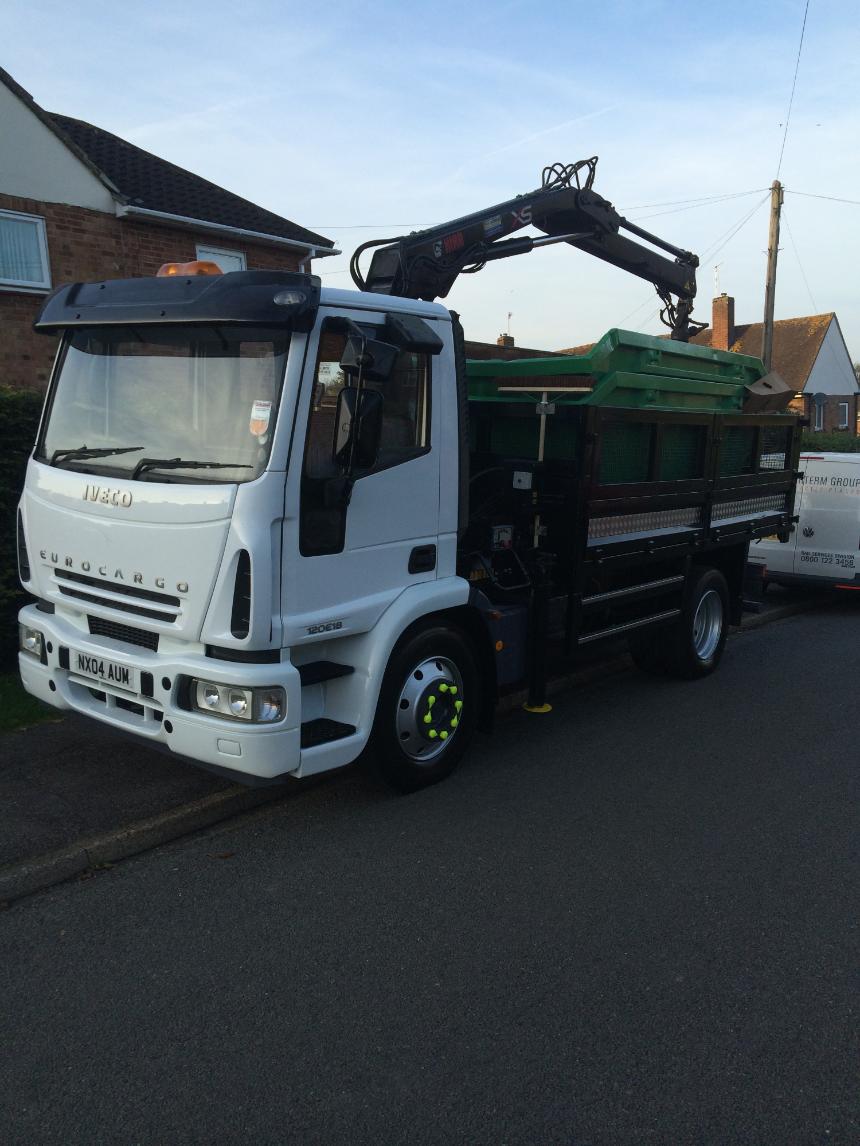 Grab lorry loaded with skips